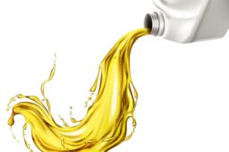 Car lubricant spilling from blank bottle vector