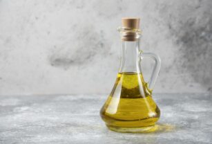 Olive oil bottle on marble table