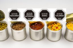 Canned food on white background. Green pea, beans, corn, lentils